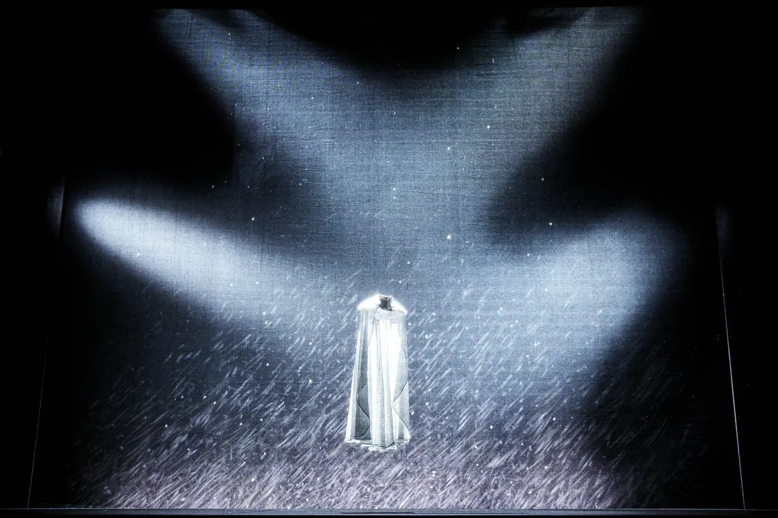 Flying dress suspended in a beam of light
