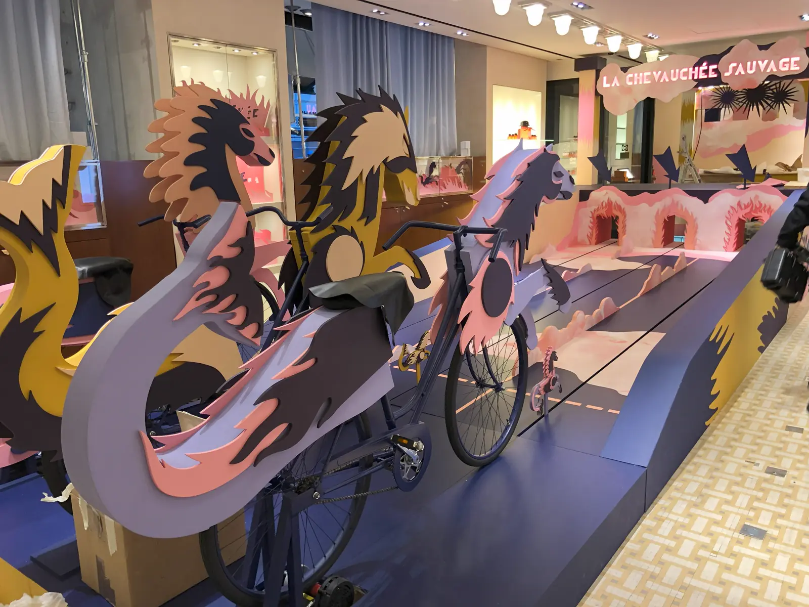 Large illustrated cut-outs installed in a shopping gallery
