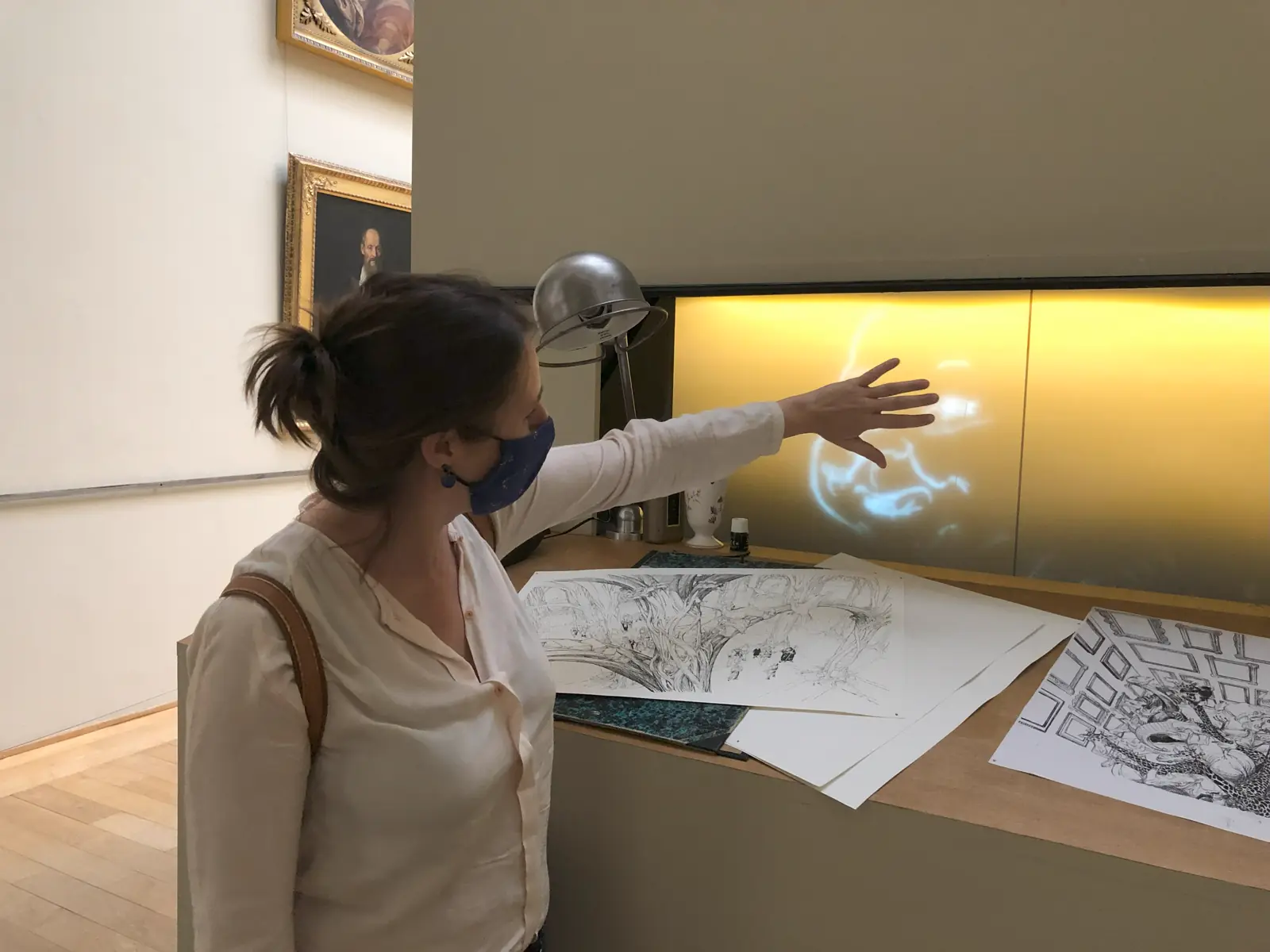 Visitor reaching out to a touchable hologram