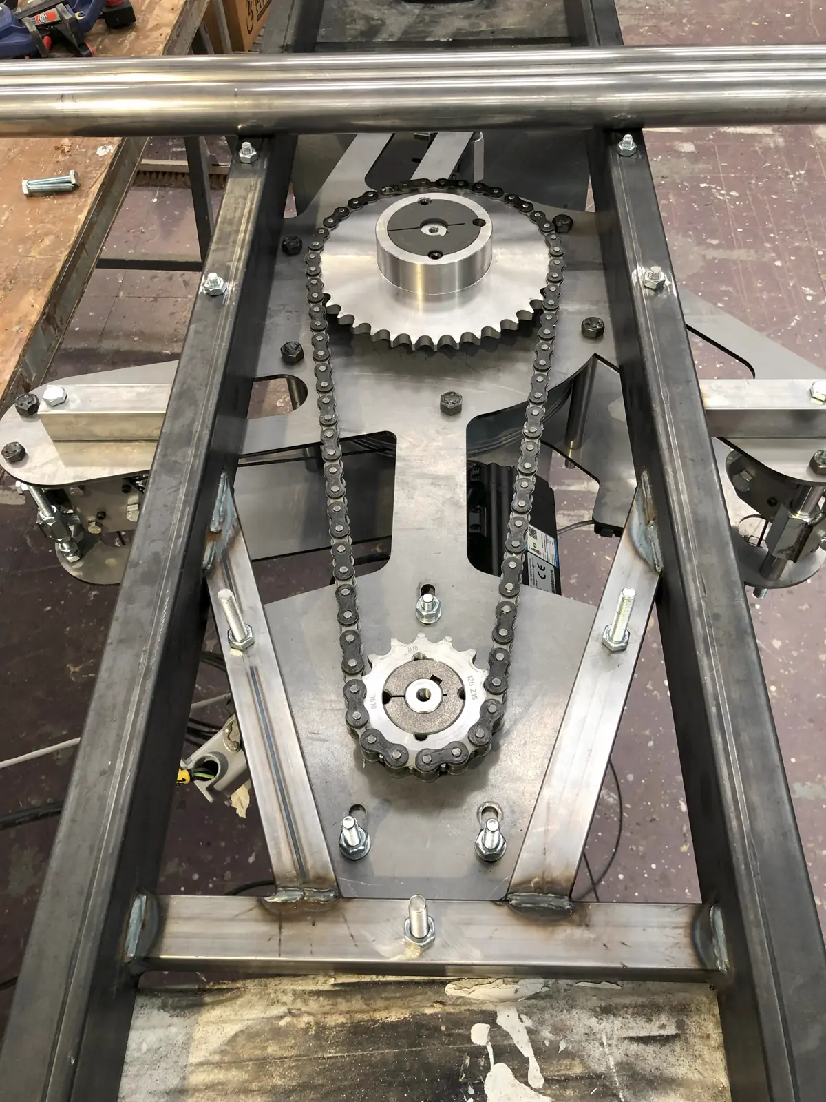 Close-up of stage machinery: sprockets, chain and frame