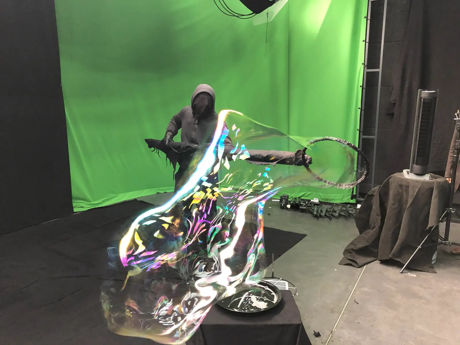 Green screen shoot: a large bubble being formed around a performer